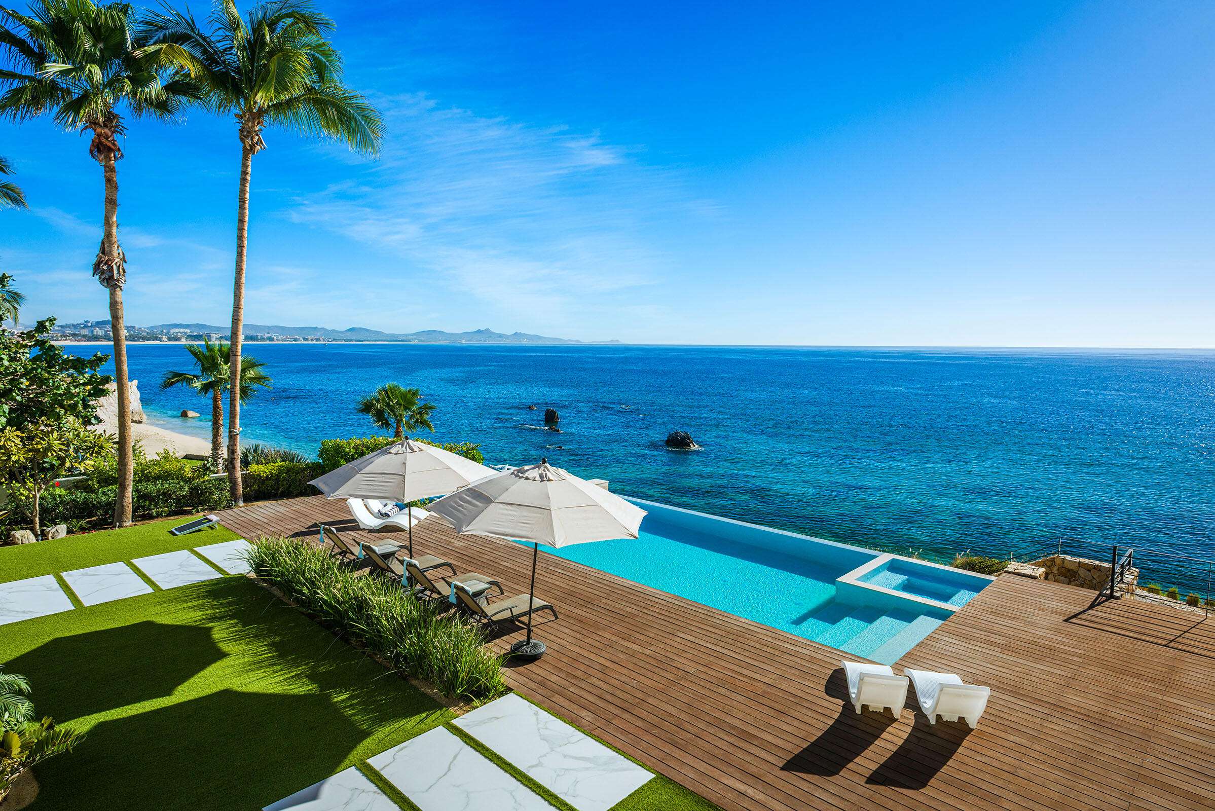 Cabo Golf La Caleta Casa Hendo is a stunning oceanfront estate perched above a swimmable cove, offering breathtaking Sea of Cortez for sale
