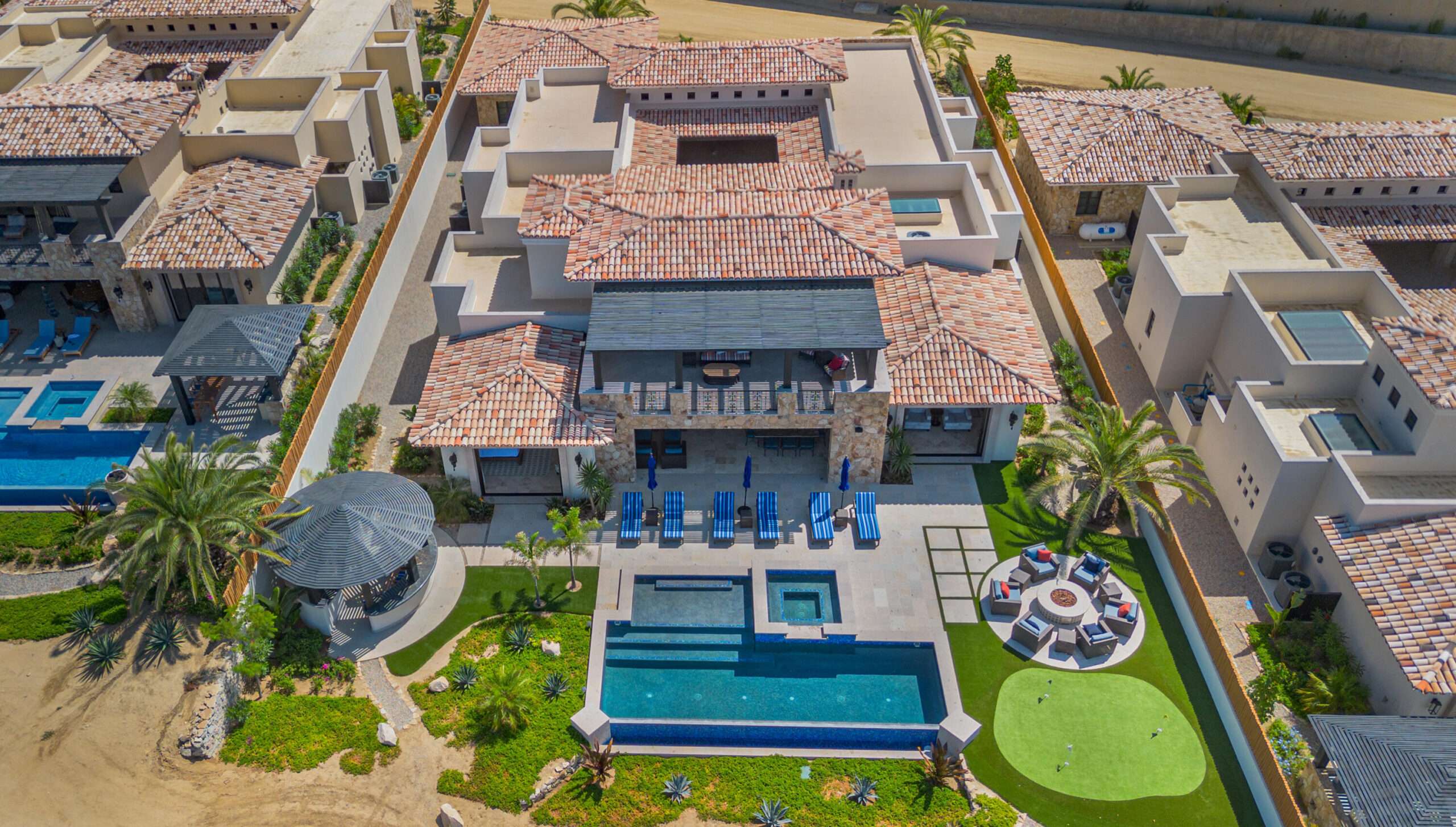 Cabo Golf La Caleta Casa Hendo is a stunning oceanfront estate perched above a swimmable cove, offering breathtaking Sea of Cortez for sale