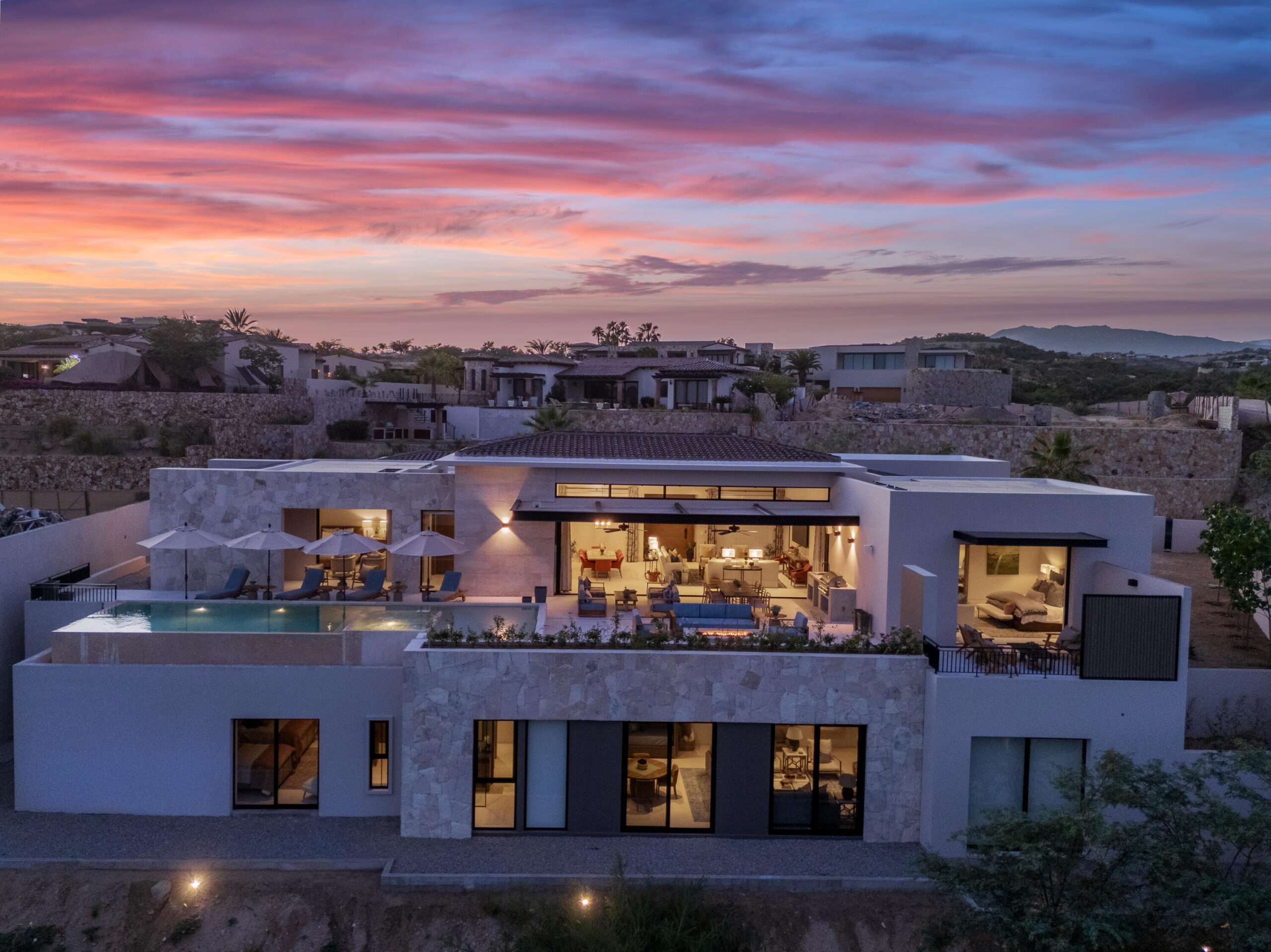 Cabo Golf Section 18- Horizontes Welcome to Horizontes 3, an exquisite custom-made home located within San José del Cabo's most sought-after community, Querencia. Surrounded by Tom Fazio's signature golf course, recognized as one of the best in the country, this stunning residence is just a short golf cart ride from the prestigious 5-star Club House. This remarkable 6-bedroom, 6.5-bathroom home elevates luxury living with a fresh vision of architecture and design. The layout features a cozy family room, an expansive bunk bed bedroom on the lower level, and a spacious maid's quarters with an independent entrance, making it ideal for entertaining family and friends.The property boasts outdoor living spaces, including tranquil green areas, an outdoor kitchen, an infinity pool, a jacuzzi, and ocean and ravine for sale