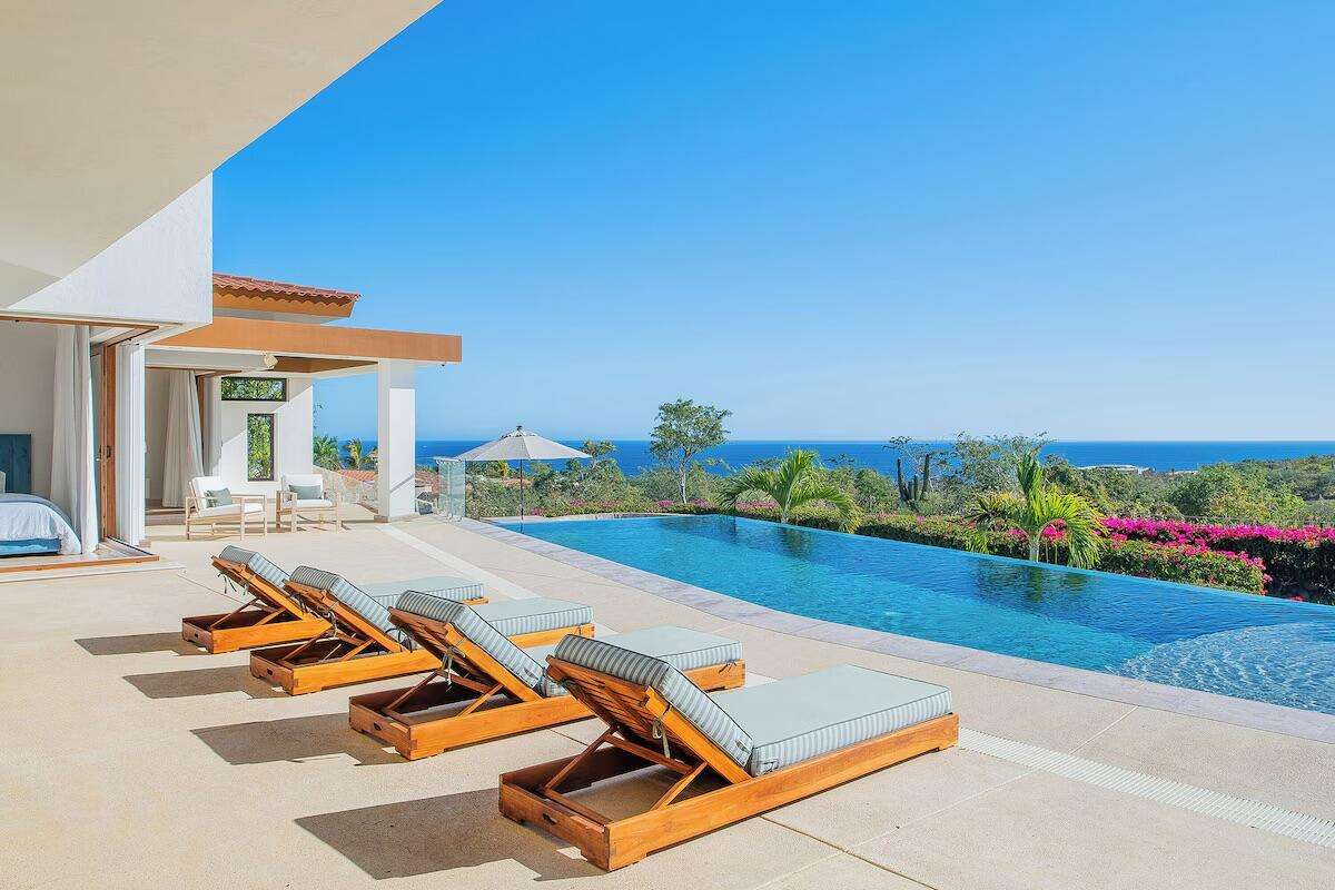 Cabo Golf Fundadores Villa Maralta 62 offers contemporary coastal living in Puerto Los Cabos.This newly built 5-bedroom residence is designed around seamless indoor-outdoor flow, with main living areas opening toward the terrace, pool, and ocean – 62 Villa Maralta, San Jose del Cabo, BS